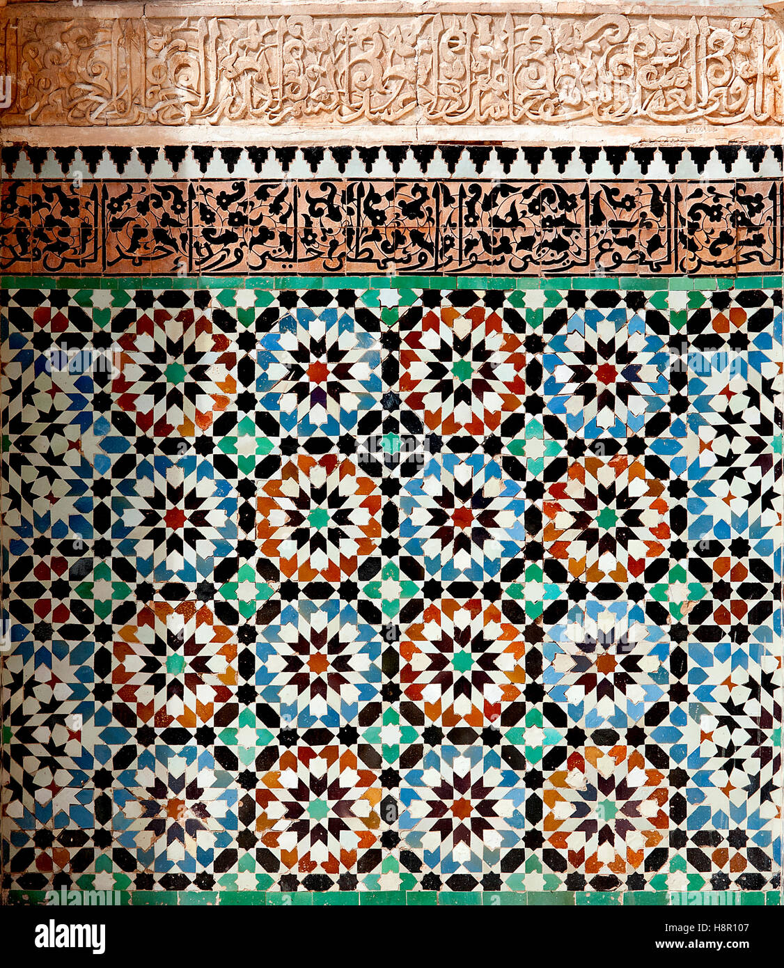 Ben Youssef 'madrasa', Marrakesh, Morocco: colorful mosaics and calligraphy adorn the walls of the Ben Youssef Islamic college. Stock Photo