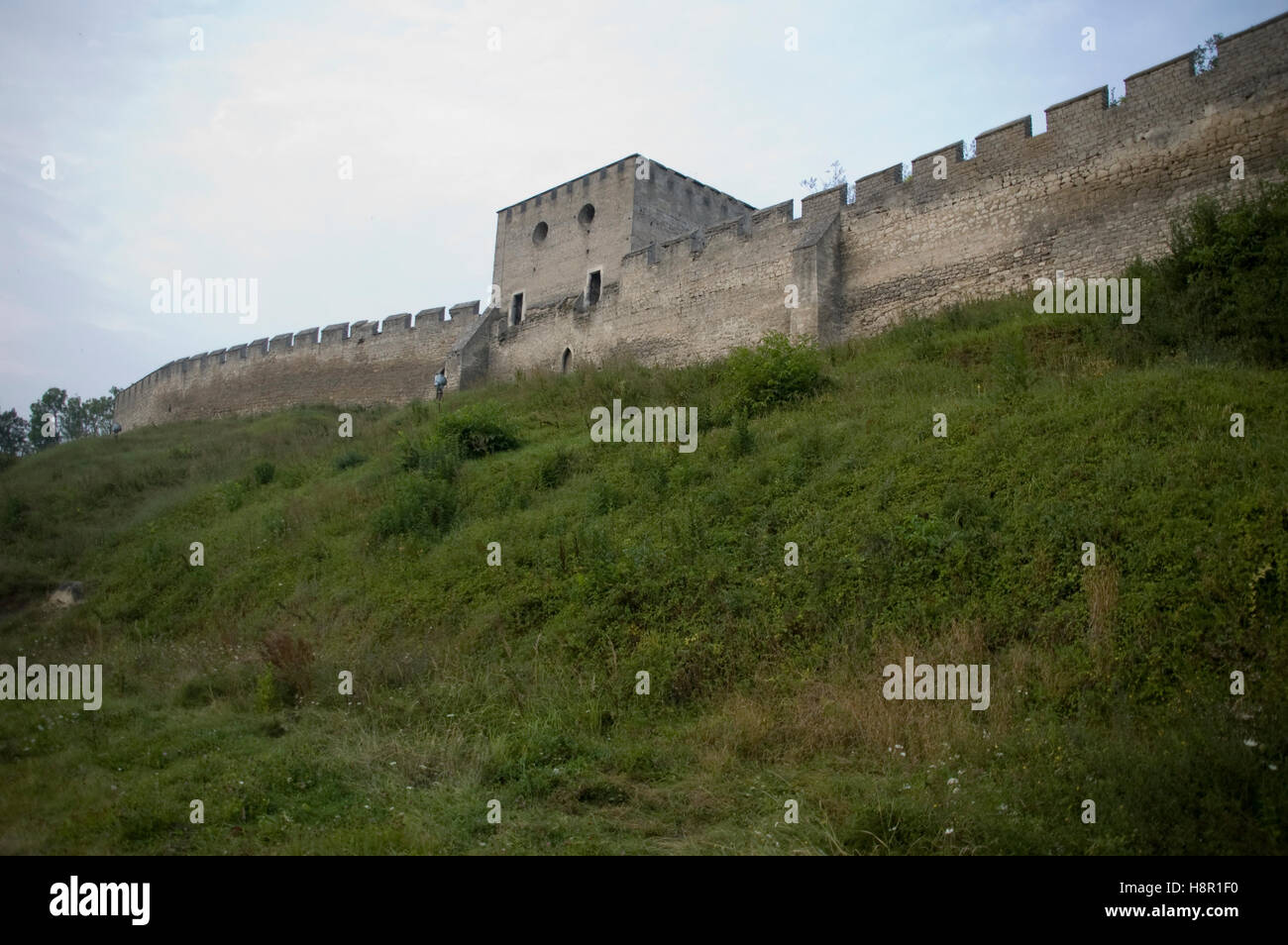 medieval city walls with grass and blue sky Stock Photo