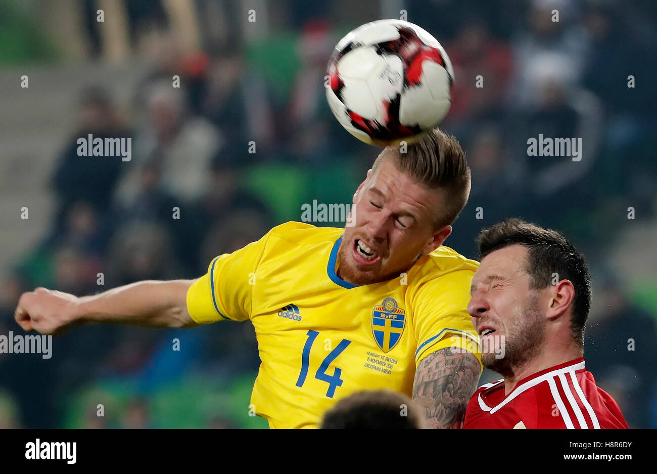 Budapest, Hungary. 15th November, 2016. Akos Elek (R) of Hungary battles for the ball in the air with Pontus Jansson #14 of Sweden during the International Friendly match between Hungary and Sweden at Groupama Arena on November 15, 2016 in Budapest, Hungary. Credit:  Laszlo Szirtesi/Alamy Live News Stock Photo