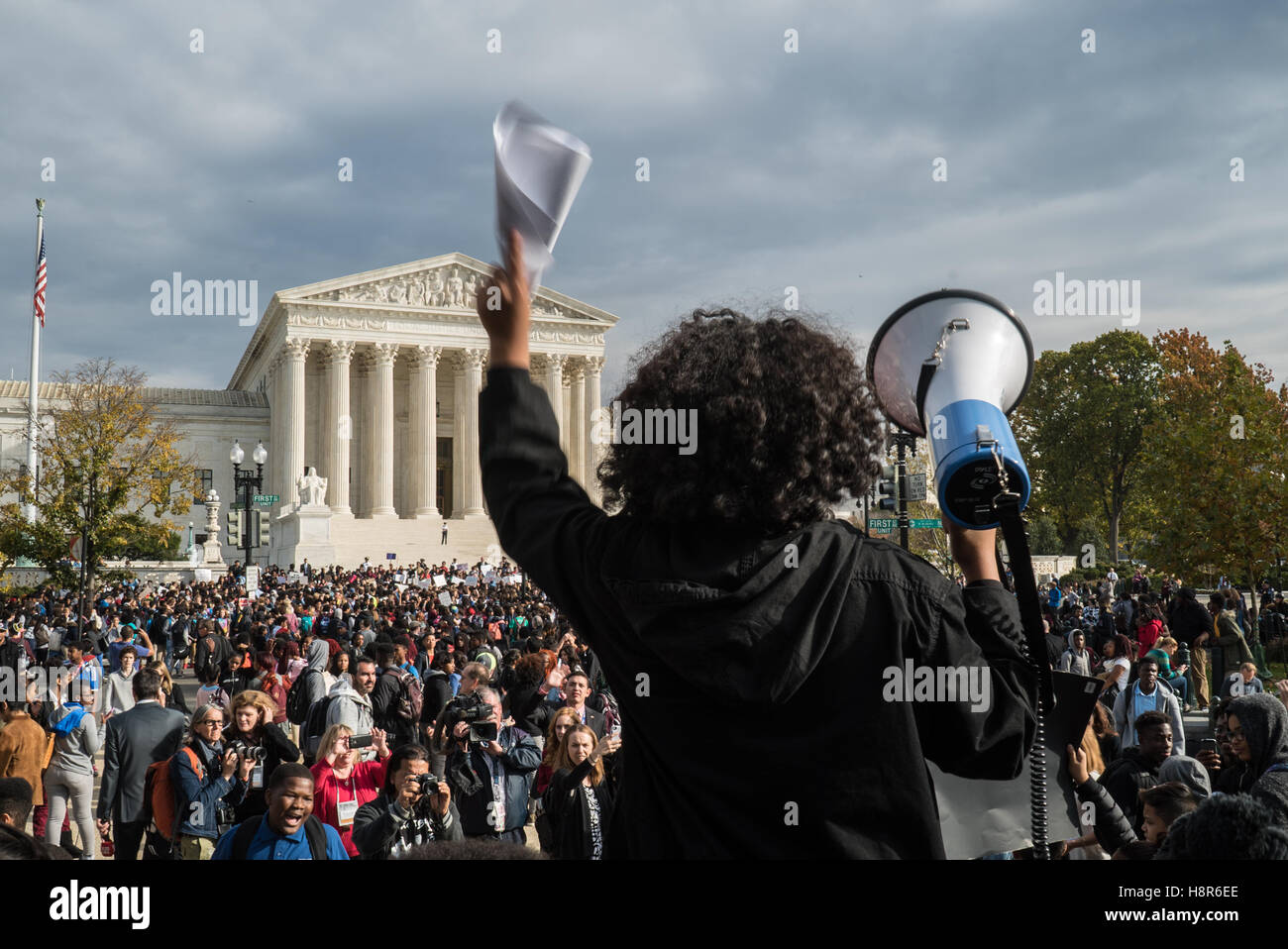 Washington DС, USA. 15th November, 2016. The students Anti Trump rally in Washington DС. A student stands with megaphone in fronf of the meeting students and the Supreme Court of the United States. Credit:  Andrey Borodulin/Alamy Live News Stock Photo