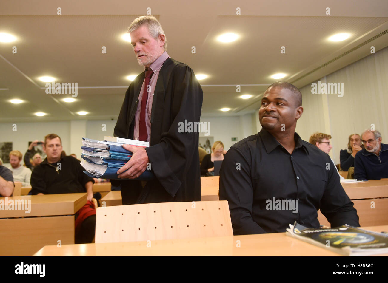Munich, Germany. 16th Nov, 2016. The deserter and former US soldier Andre Shepherd, (R) looks to