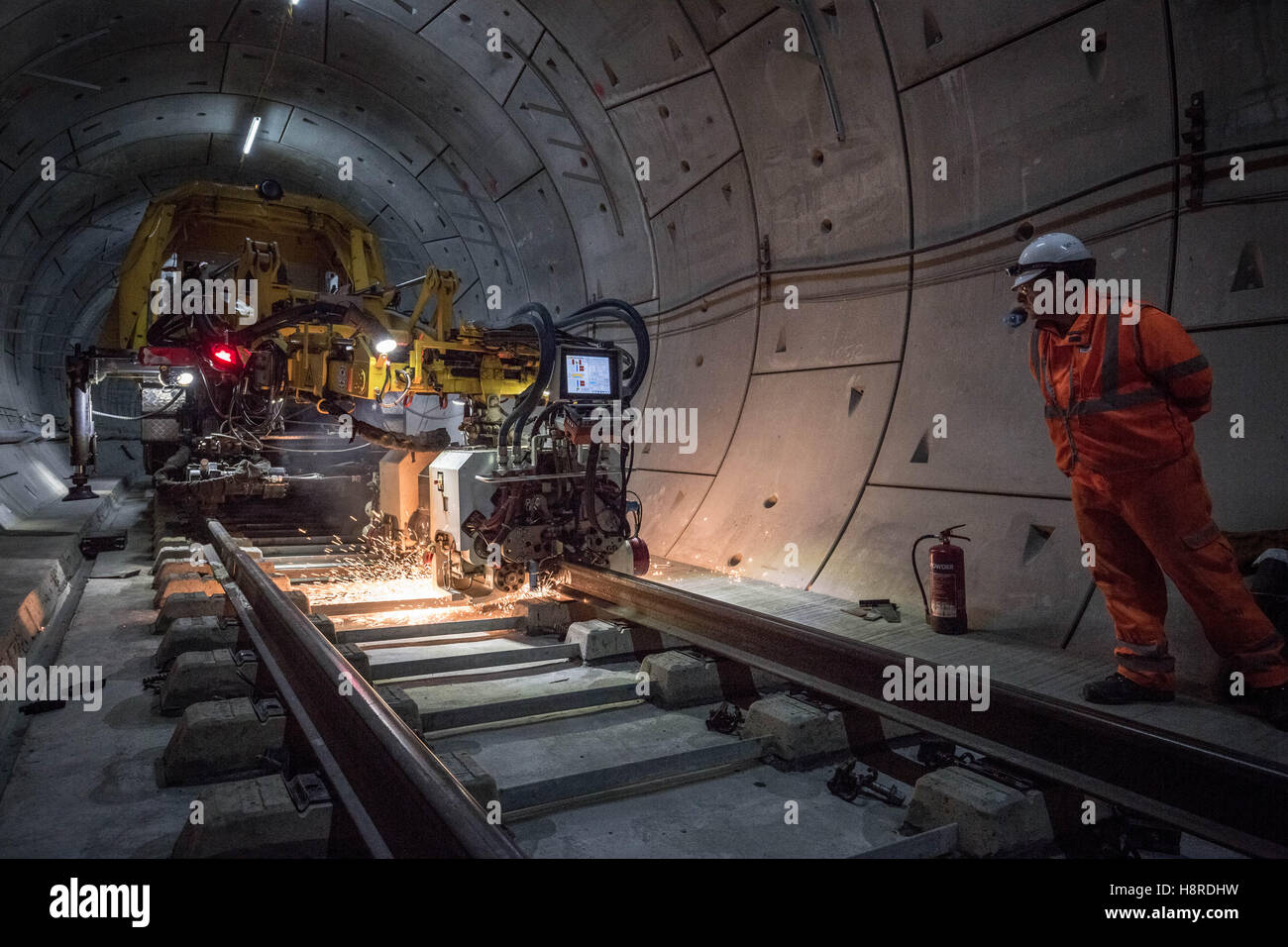 London, UK. 16th November, 2016. Crossrail Stepney Green station in East London. Westbound. Workers position a mobile welding unit and begin to seal-weld the joins on the recently laid train tracks Credit:  Guy Corbishley/Alamy Live News Stock Photo