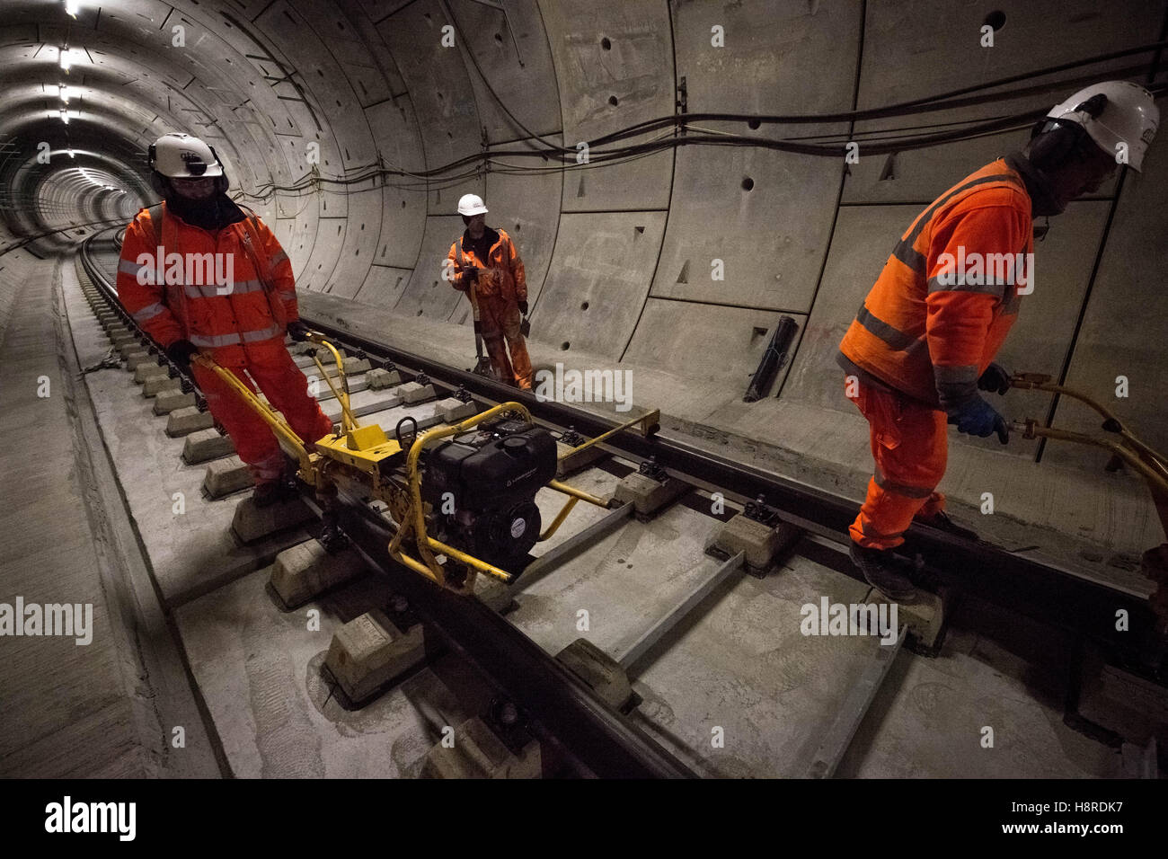 London, UK. 16th November, 2016. Crossrail Stepney Green station in East London. Westbound station. Workers grind and smooth the rail surface of the recently laid train tracks. Credit:  Guy Corbishley/Alamy Live News Stock Photo