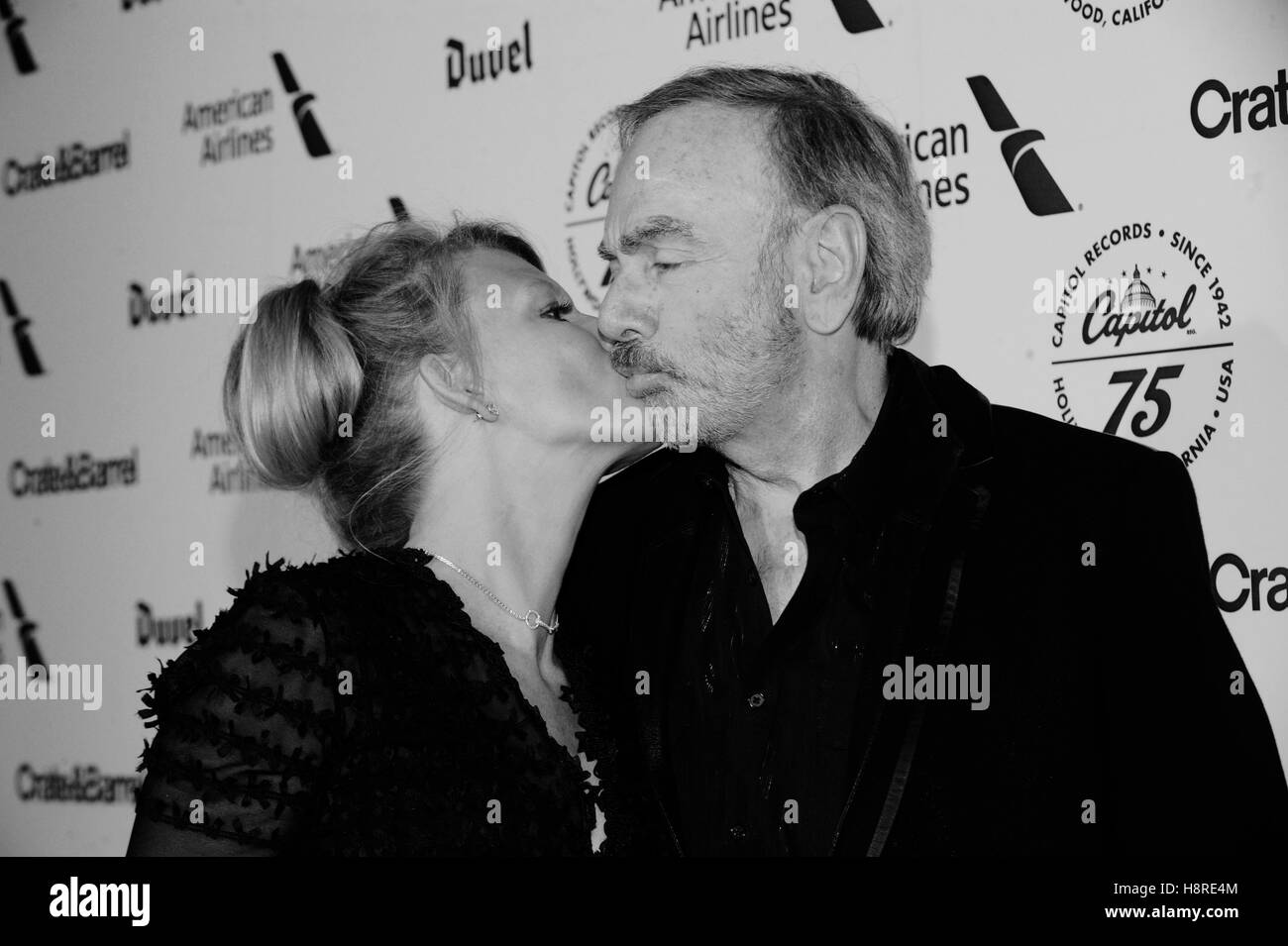 Los Angeles, USA. 15th November 2016.Musician Neil Diamond and Katie McNeil kissing at the Hollywood Gala celebrating Capitol Records 75th Anniversary on November 15, 2016 in Los Angeles, California.(Digitally altered black and white) © The Photo Access/A Stock Photo