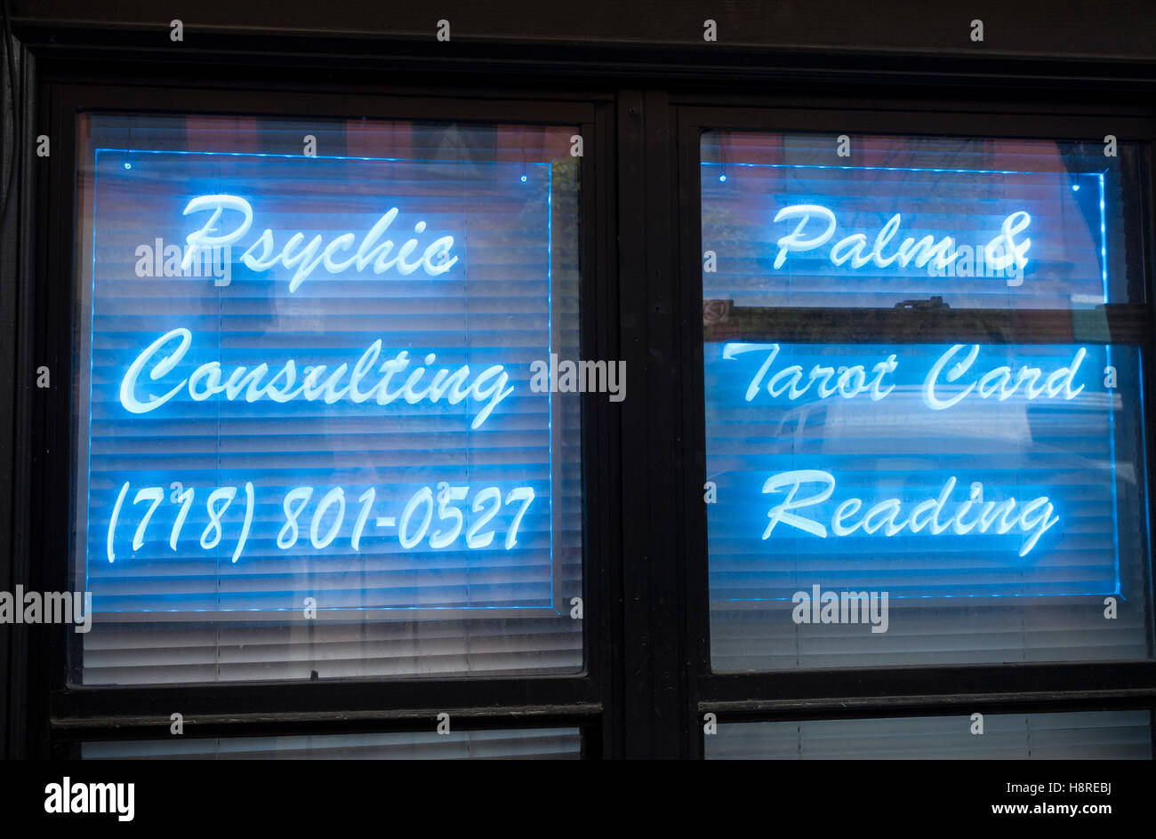 Psychic consulting neon sign in New York City Stock Photo