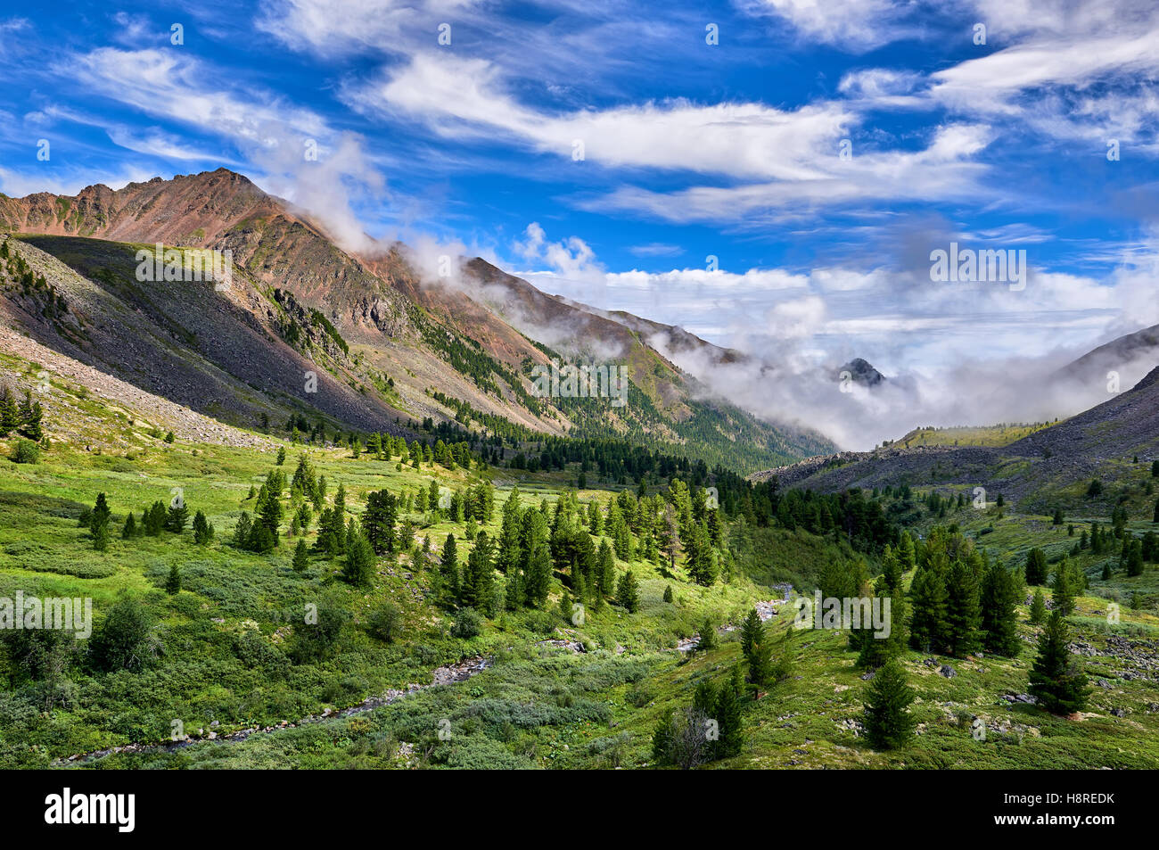 Beautiful sky over fabulous mountain valley. Eastern Sayan. Russia Stock Photo