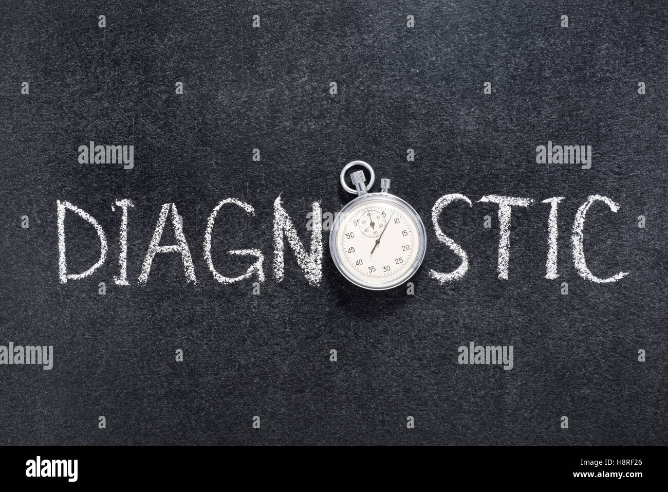 Diagnostic word handwritten on chalkboard with vintage precise stopwatch used instead of O Stock Photo