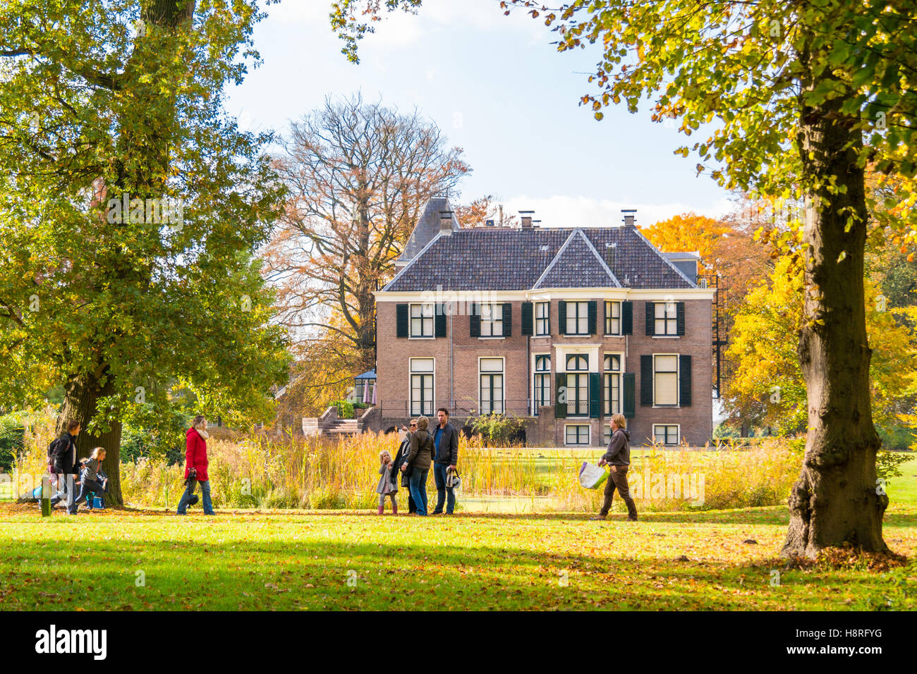 People enjoying sunshine on autumn day in park of estate Boekesteyn, 's Graveland, Netherlands Stock Photo