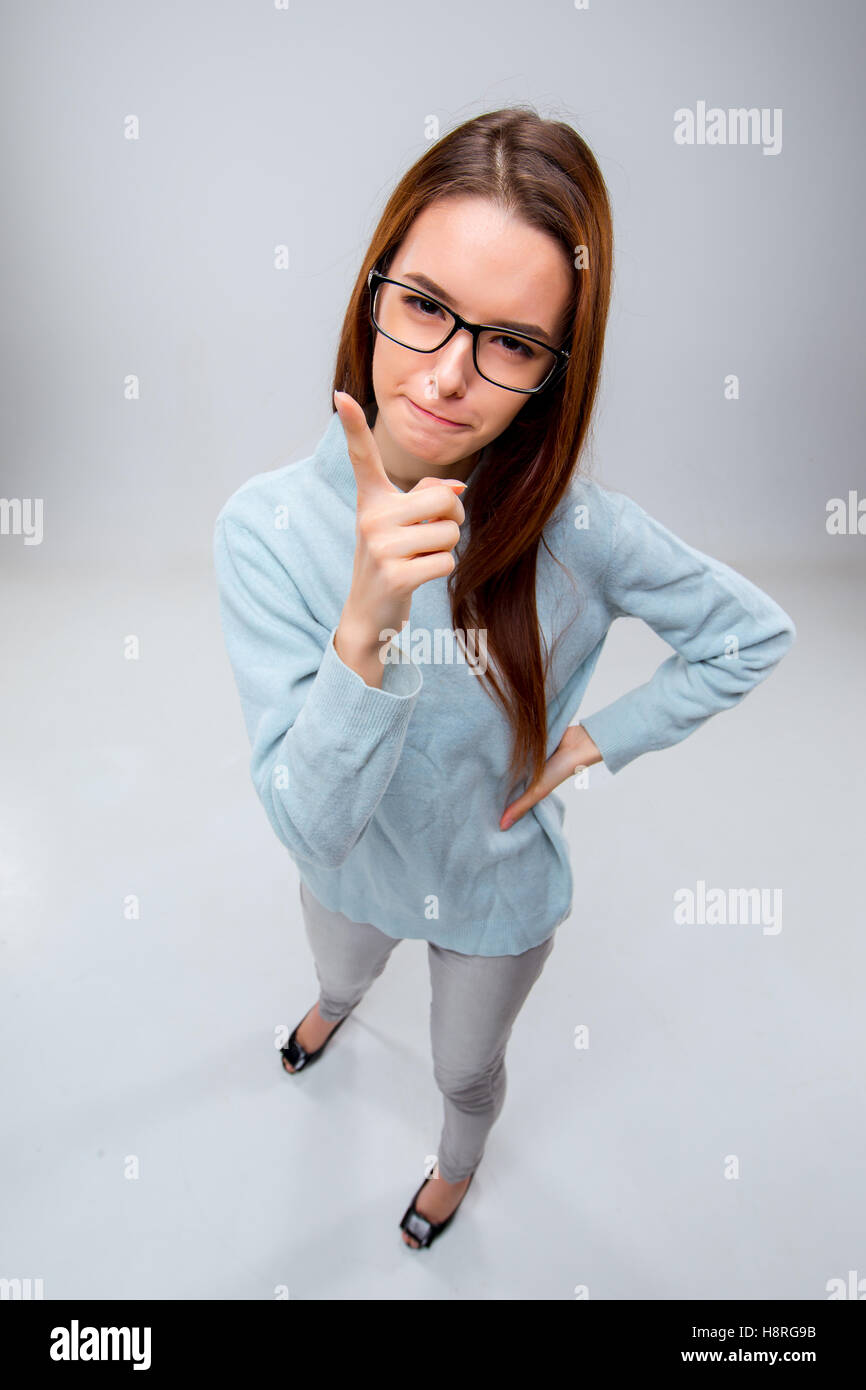 The young business woman on gray background Stock Photo - Alamy