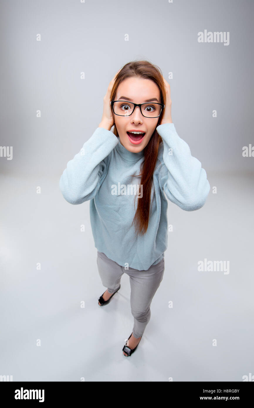 The smiling young business woman on gray background Stock Photo - Alamy