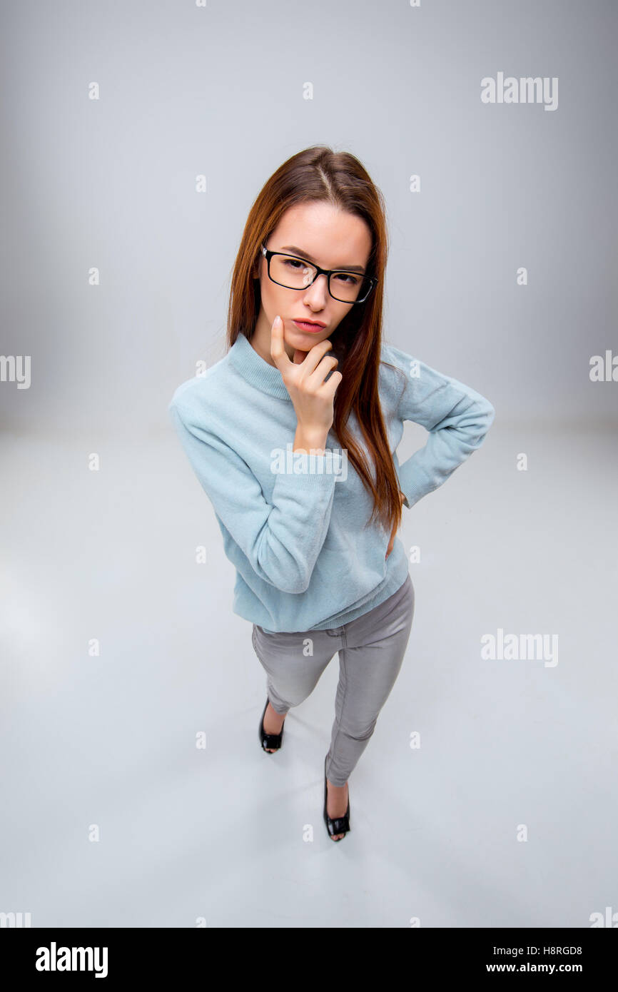 The young business woman on gray background Stock Photo - Alamy