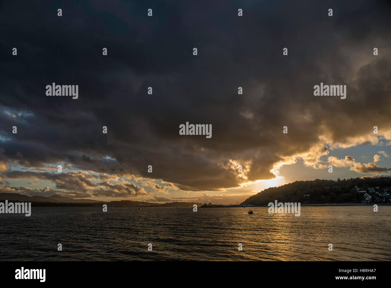 Menai Straits Anglesey North wales uk. sunset, cloudy. autumn. seascape. landscape. snowdonia. Stock Photo