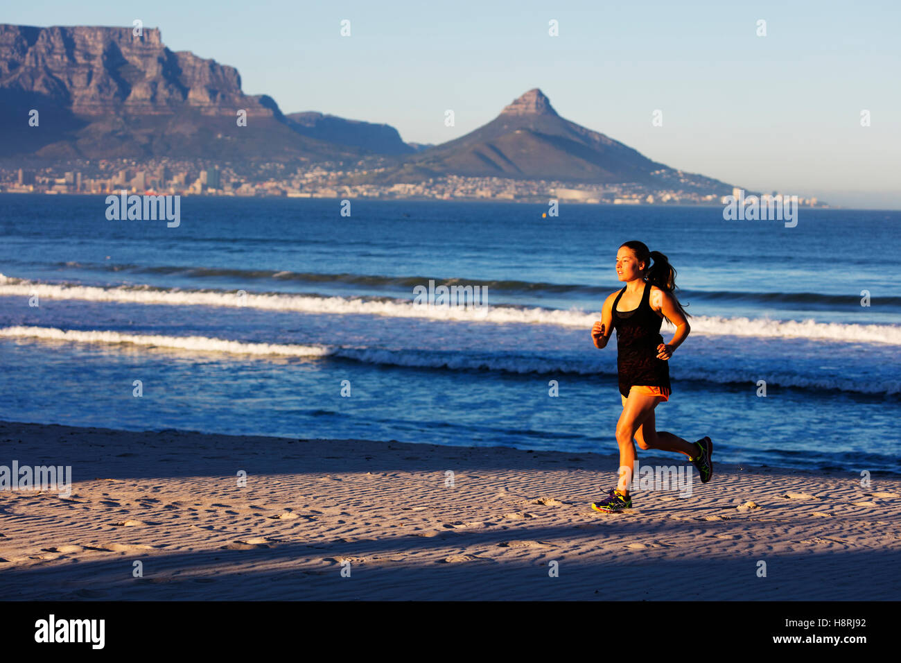 South Africa, Western Cape, Cape Town, runner on a beach (MR Stock Photo Alamy