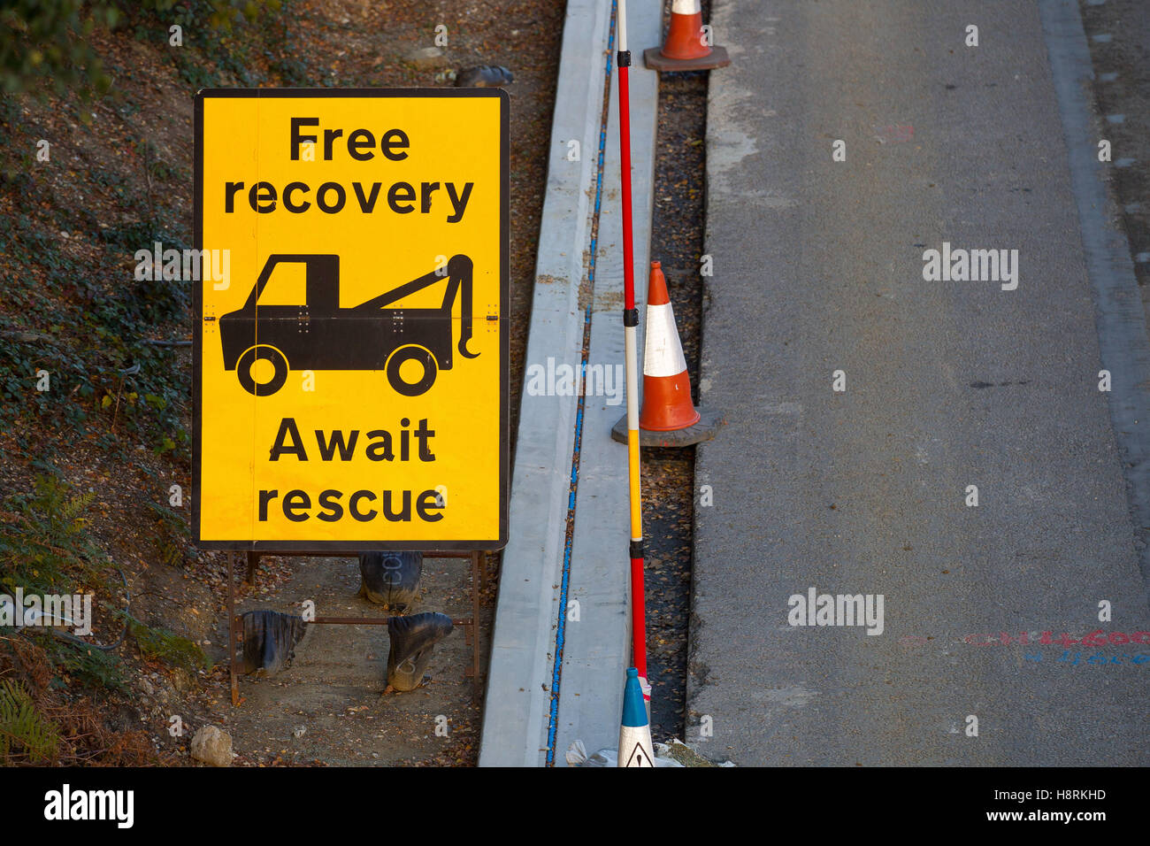 Free recovery await rescue roadworks sign on the M3 in Surrey, England ...