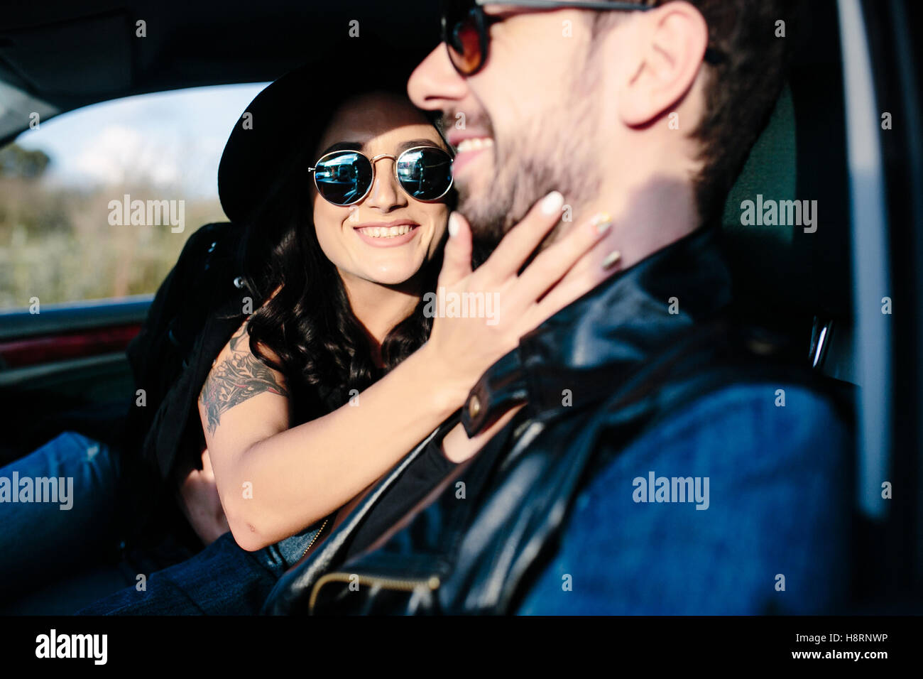 Portrait of young beautiful couple in the car Stock Photo - Alamy