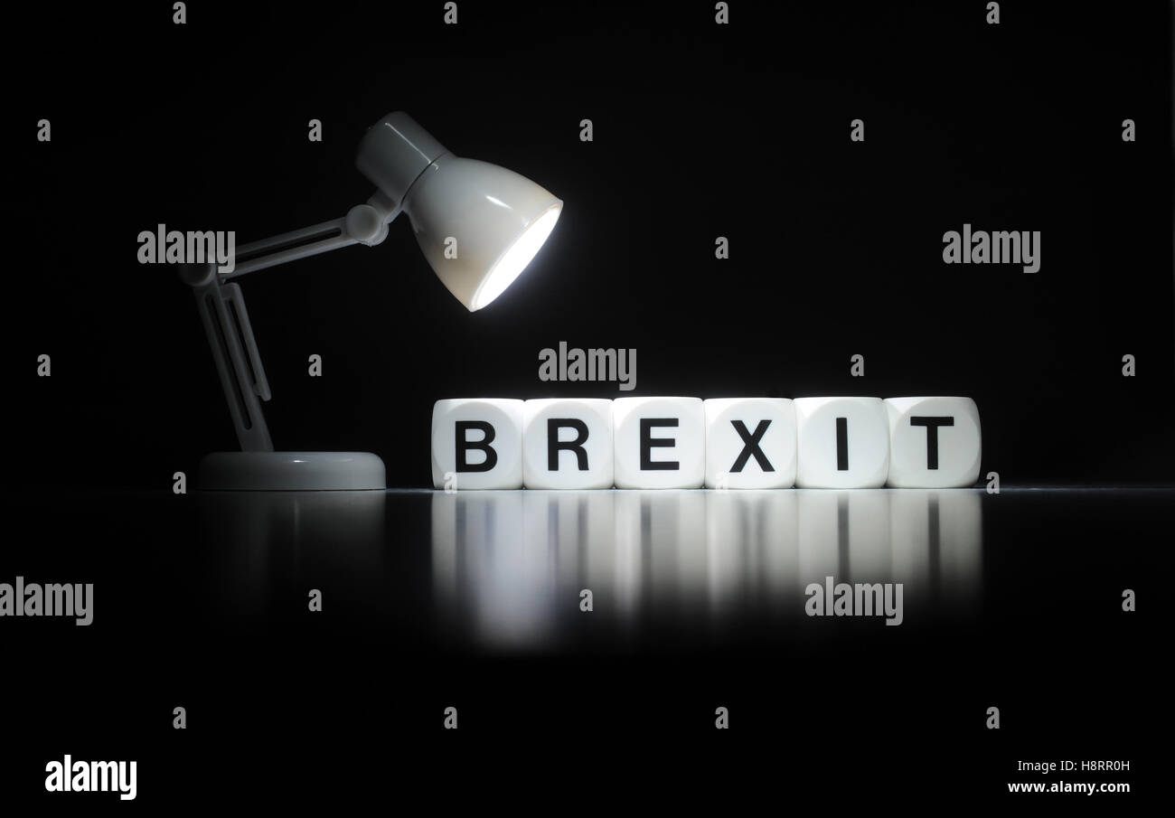 WORD DICE SPELLING 'BREXIT' WITH SPOTLIGHT RE BREXIT THE EUROPEAN UNION LEAVE VOTE REFERENDUM THE ECONOMY BRITISH BRITAIN EU UK Stock Photo