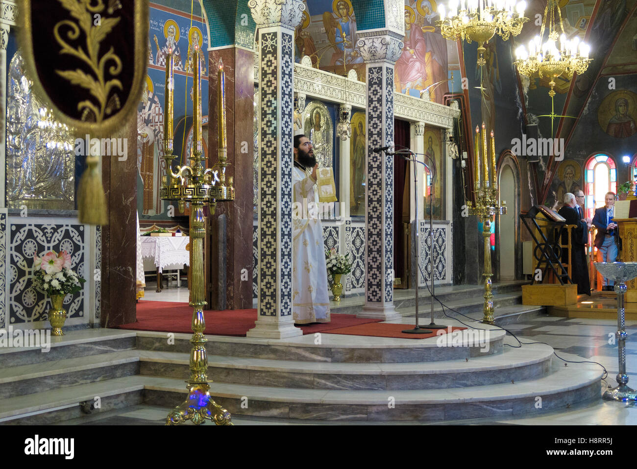 Priest celebrating orthodox mass in Athens, Greece, Europe Stock Photo