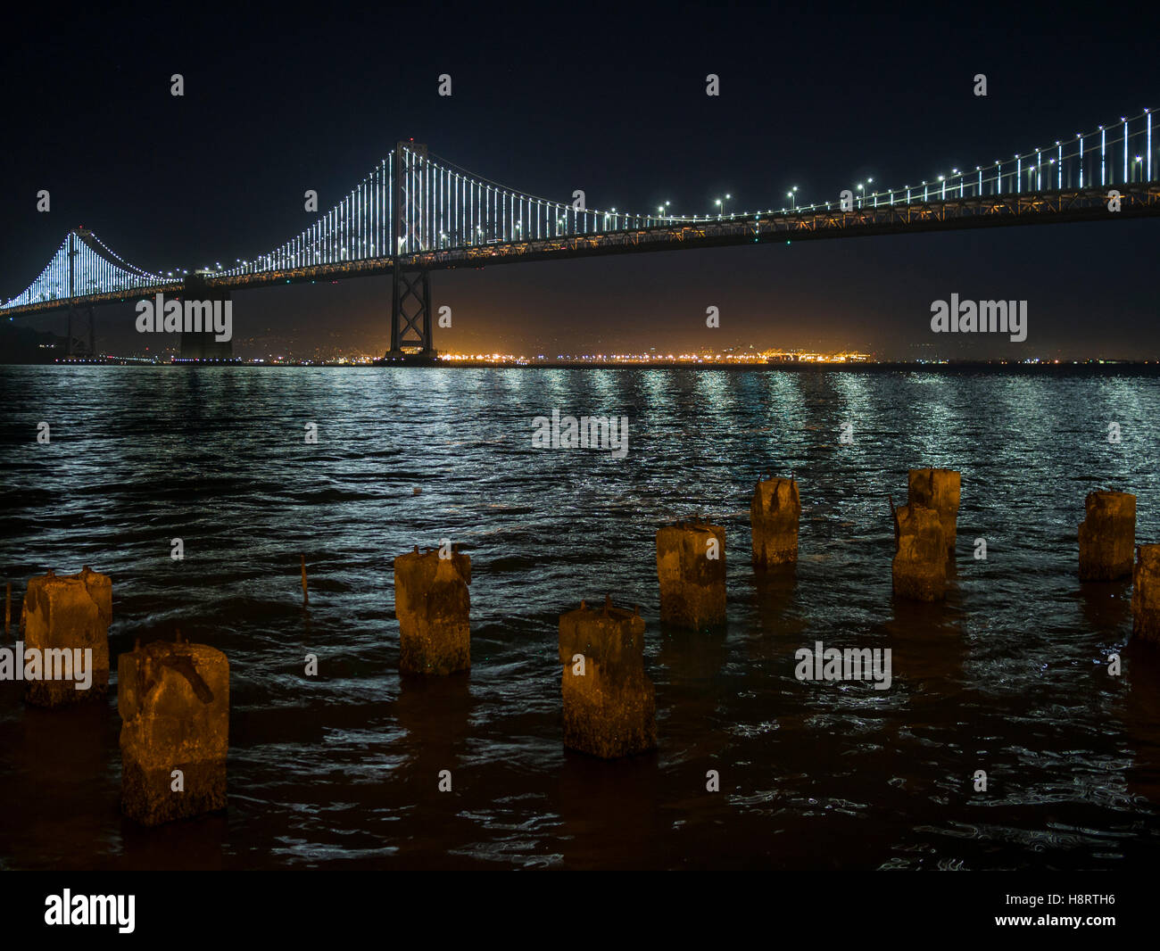Night view of the San Francisco–Oakland Bay Bridge (known locally as the Bay Bridge) spanning San Francisco Bay in California Stock Photo