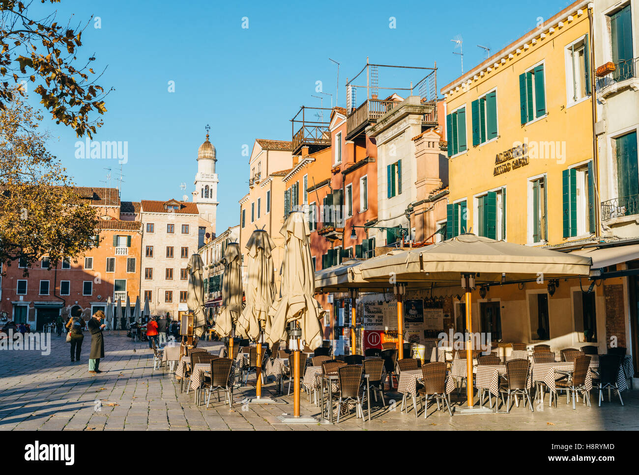People are strolling around Campo Santo Stefano, Venice, Italy Stock Photo