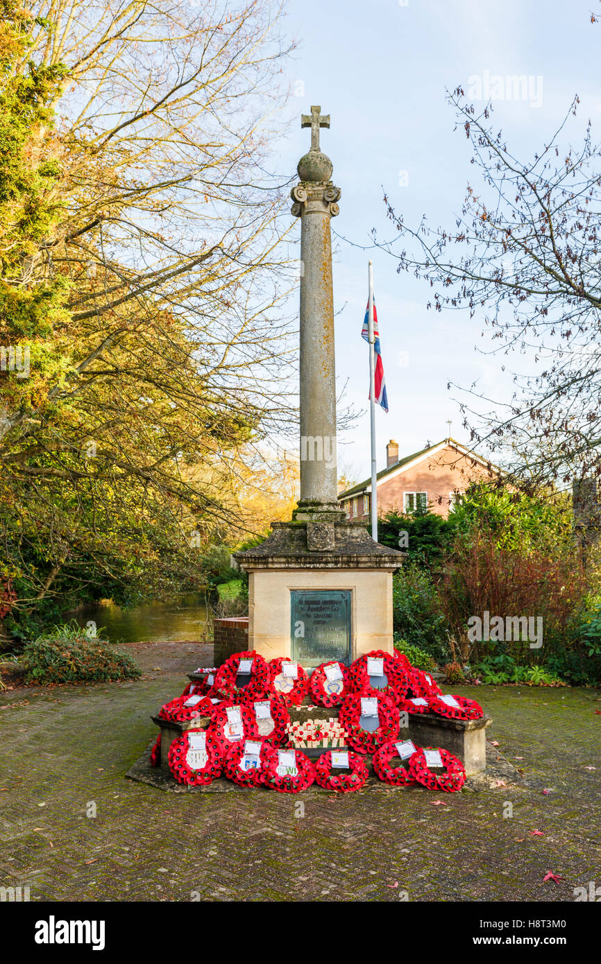 Typical First World War (Great War 1914-1918) war memorial with many poppy wreaths laid on Remembrance Sunday, Hungerford, Berkshire, southern England Stock Photo