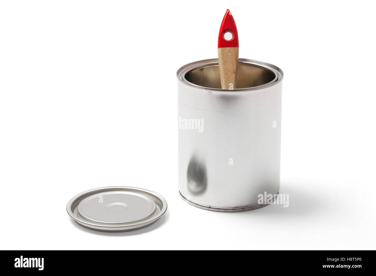 Brush in an open blank metallic paint can with clipping path isolated on white. Stock Photo