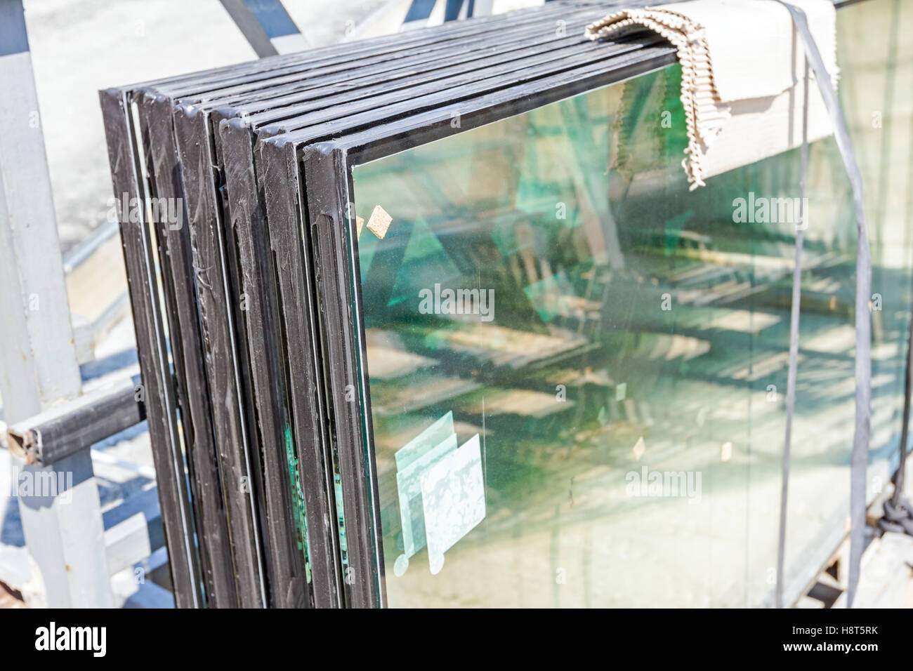 Double glazed glass window stacked and ready for build in. Stock Photo