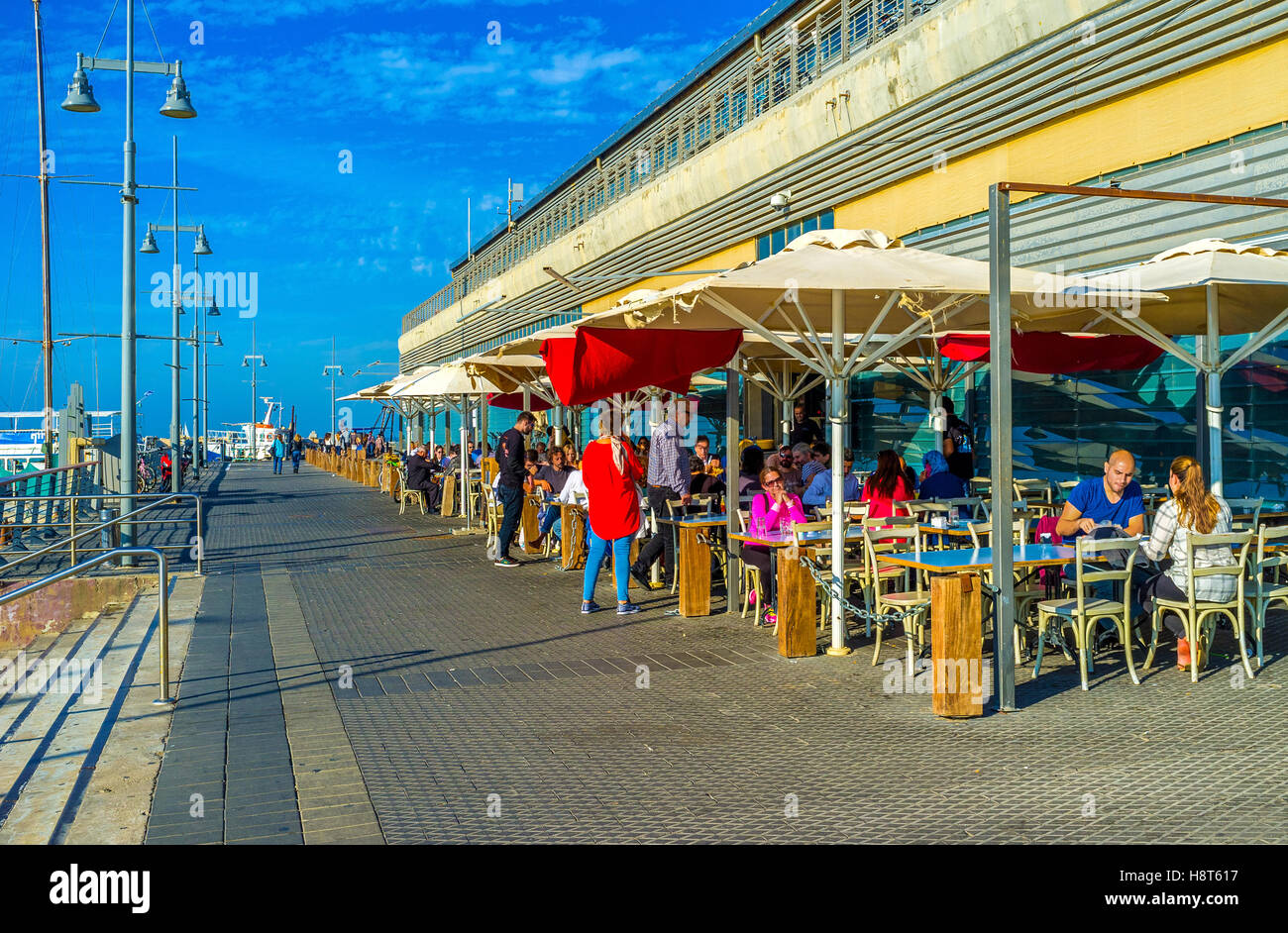The crowded outdoor cafe in the old fishing port offers the best seafood in city Stock Photo Alamy