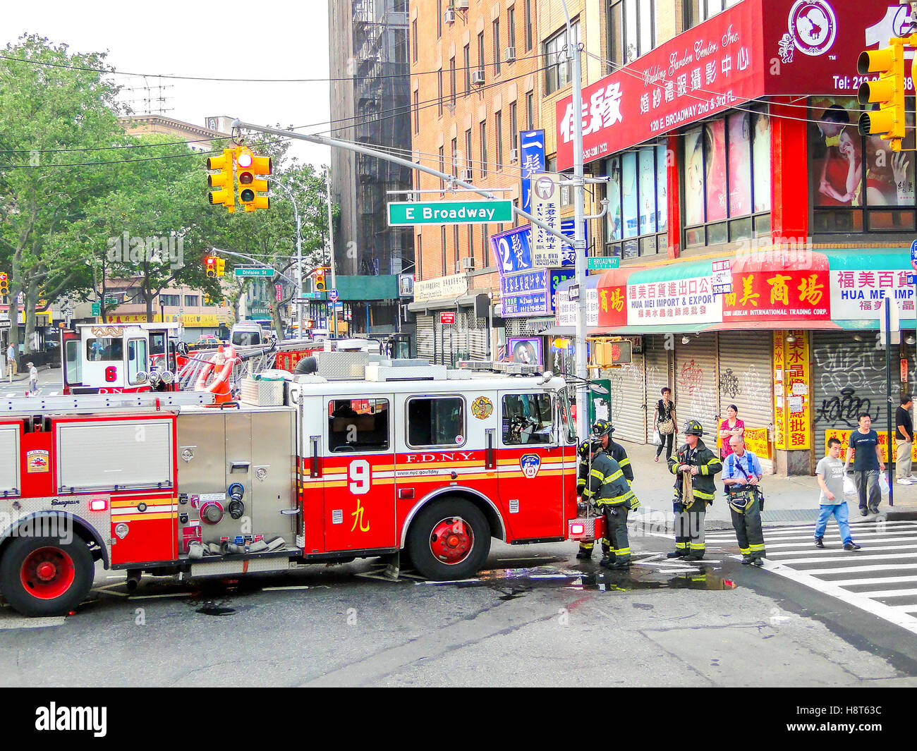 FDNY firefighters at work in Chinatown East Broadway Stock Photo