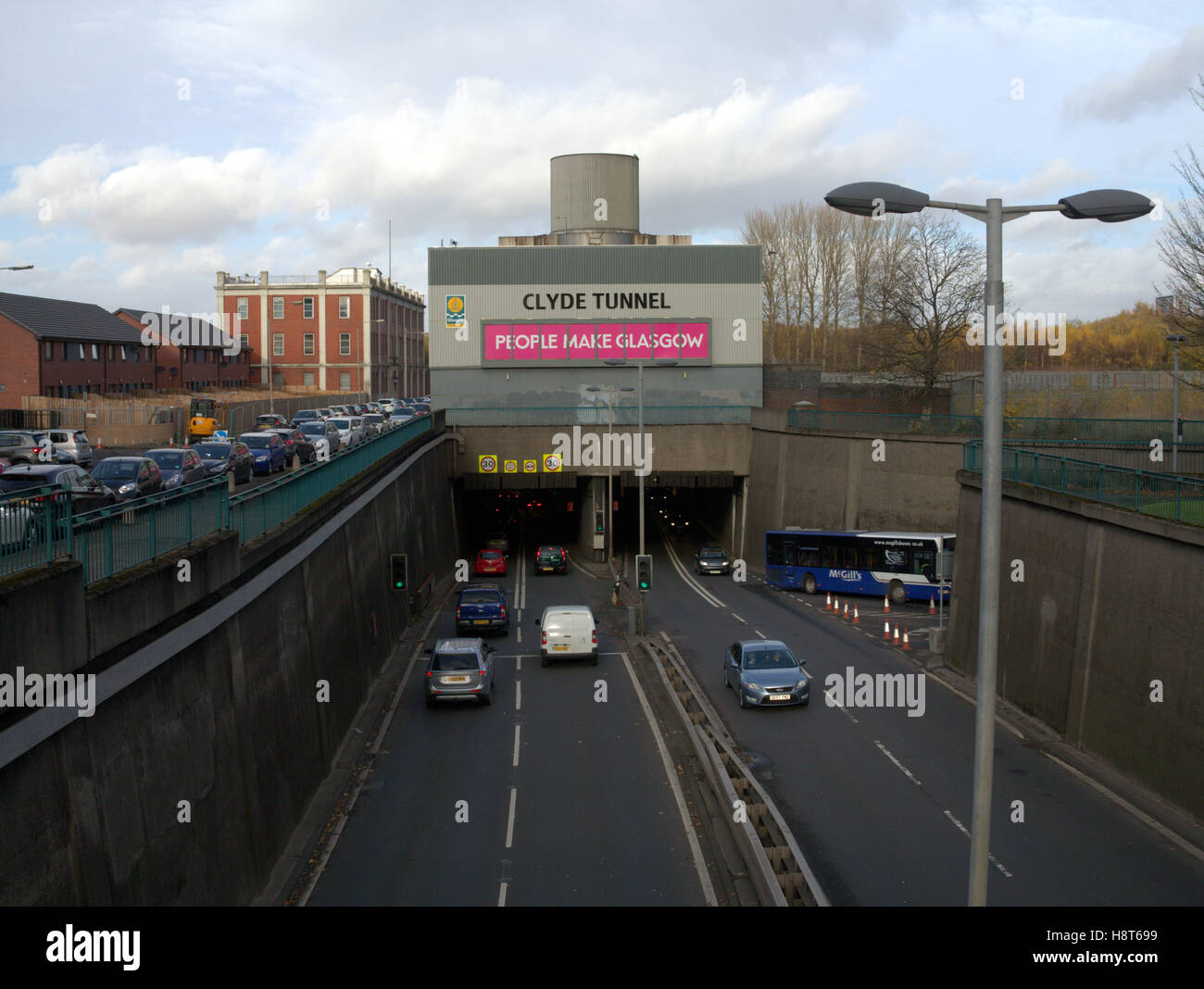 Clyde tunnel south entrance southern exit  people make glasgow sign cars traffic Stock Photo