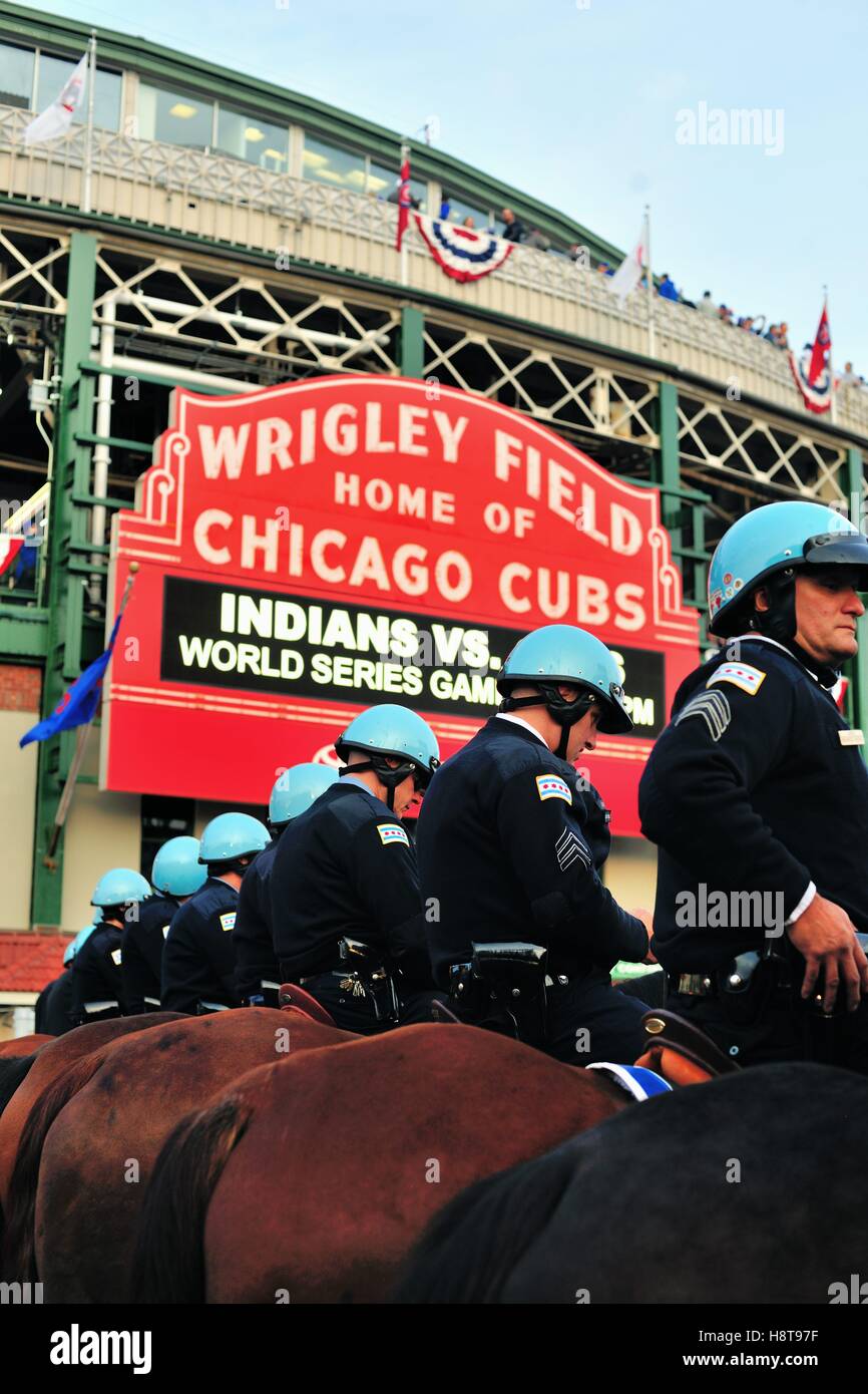 Prior to Game 3 of the 2016 World Series, a group of mounted police officers create a line outside Wrigley Field in Chicago, Illinois, USA. Stock Photo
