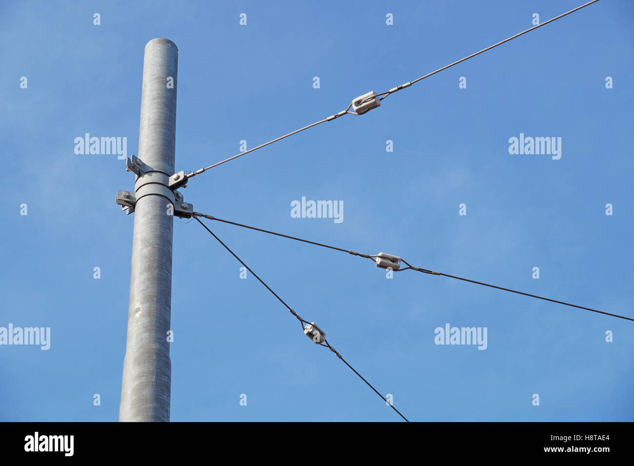 tram wires with blue sky background Stock Photo
