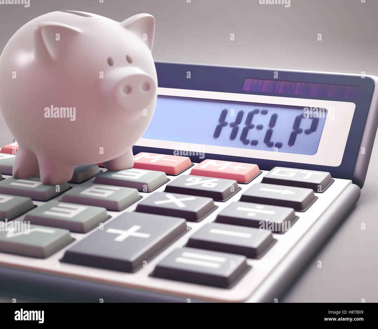 Piggy bank on a calculator that shows the word 'HELP' on the display. Stock Photo