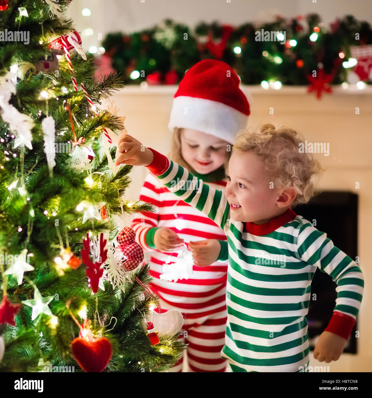 family on christmas eve at fireplace kids opening xmas presents stock photo 125926676 alamy - Xmas Presents family on christmas eve at fireplace kids opening xmas presents stock photo 125926676 alamy - Xmas Presents