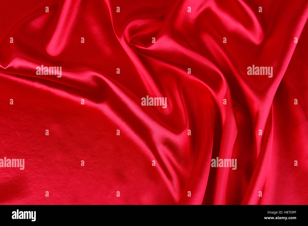 Closeup of ripples in red silk fabric Stock Photo - Alamy