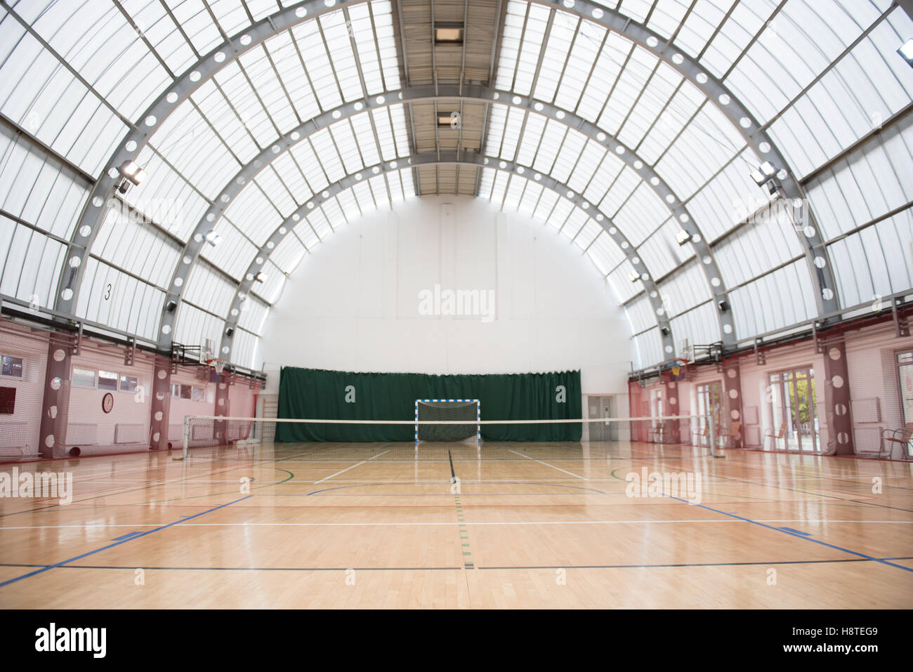 Big and light indoor tennis court Stock Photo Alamy