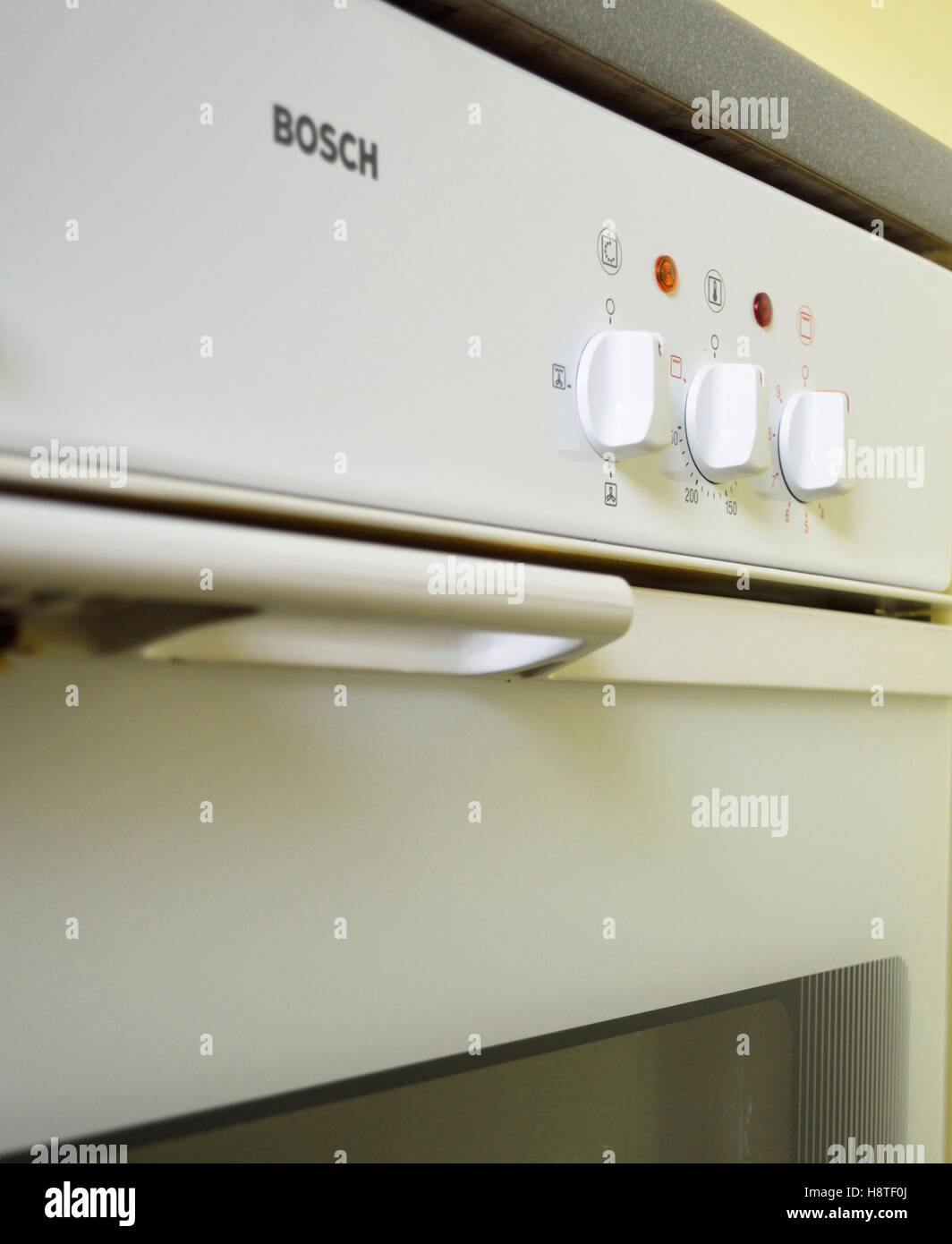 Old white Bosch oven built in the 1980s. Stock Photo