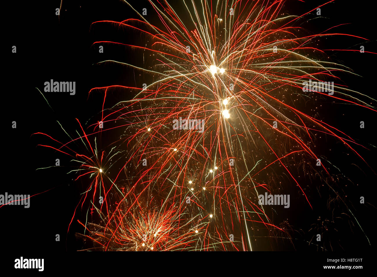 Colorful fireworks in the night sky made the party became more festive. Stock Photo