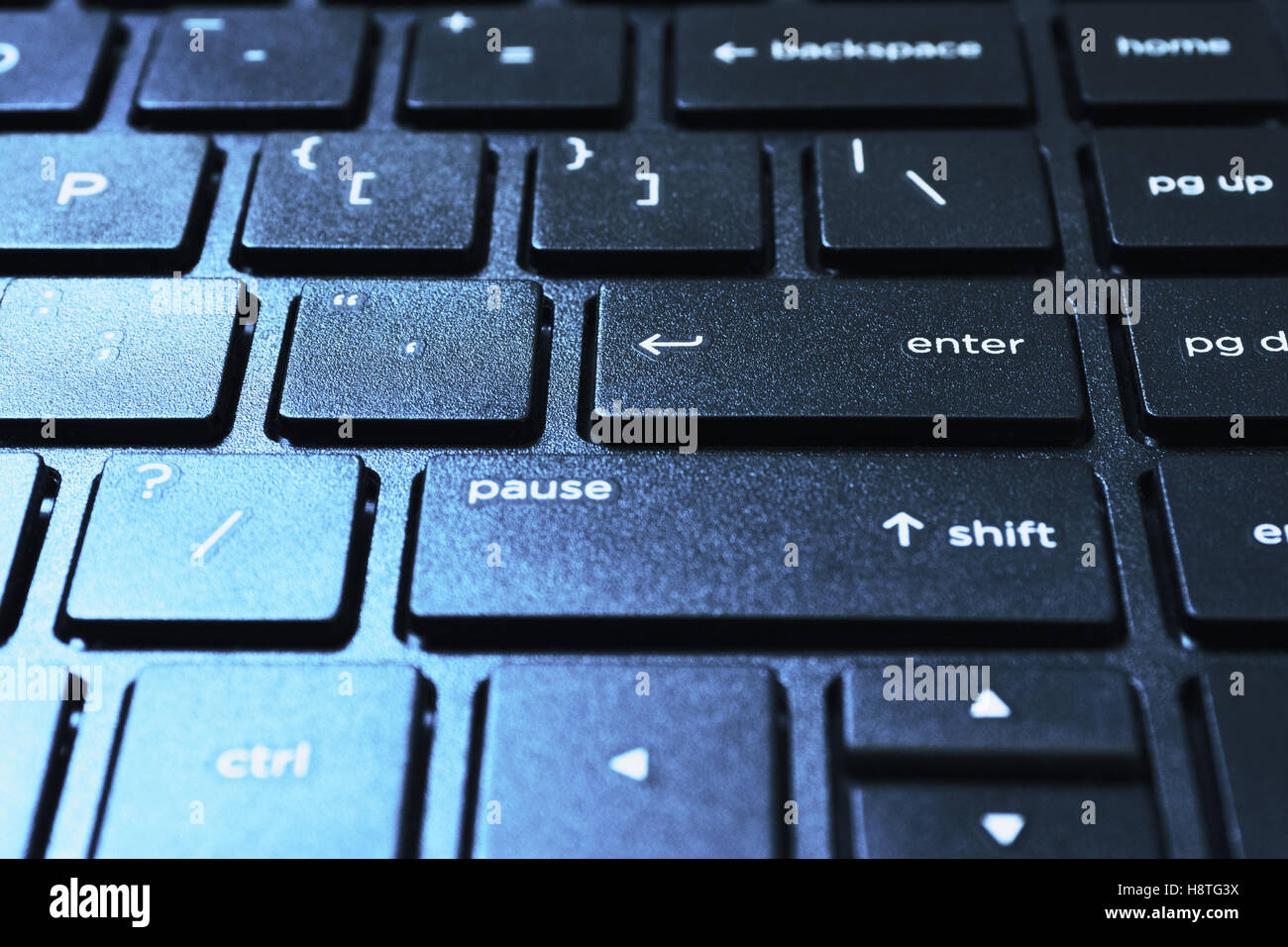 Right side of island styled laptops keyboard. Shot in closed distance with single lighting technique. Stock Photo