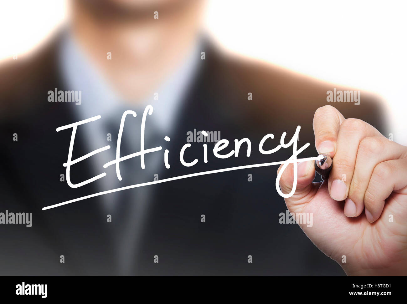 efficiency written by hand, hand writing on transparent board, photo Stock Photo