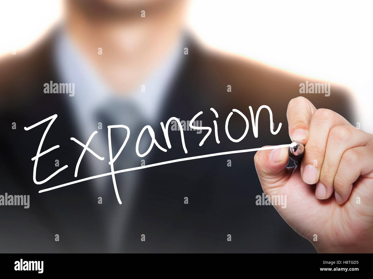 expansion written by hand, hand writing on transparent board, photo Stock Photo