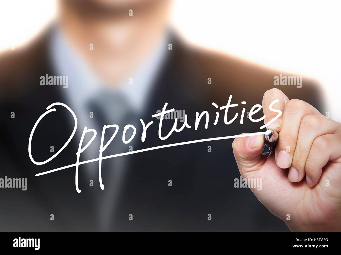 opportunities written by hand, hand writing on transparent board, photo Stock Photo