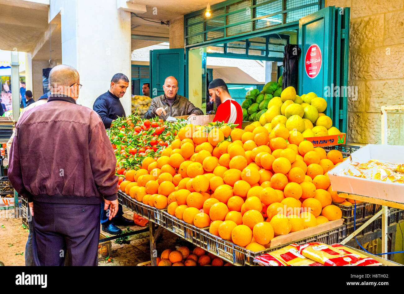 The merchant sells fruits to clients in Bethlehem market Stock Photo
