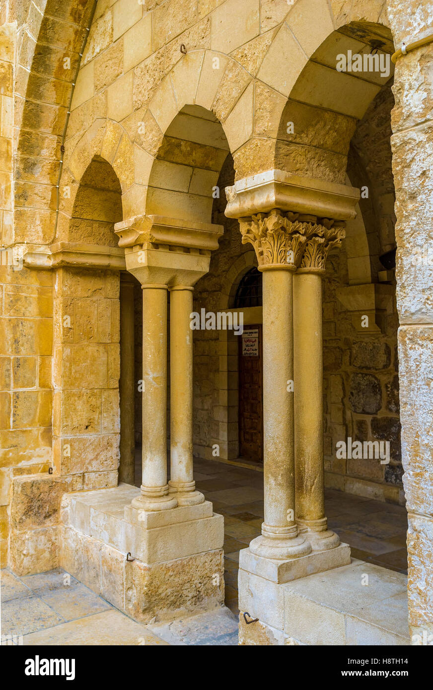 The stone columns and arches of the courtyard of the Church of the Nativity Stock Photo