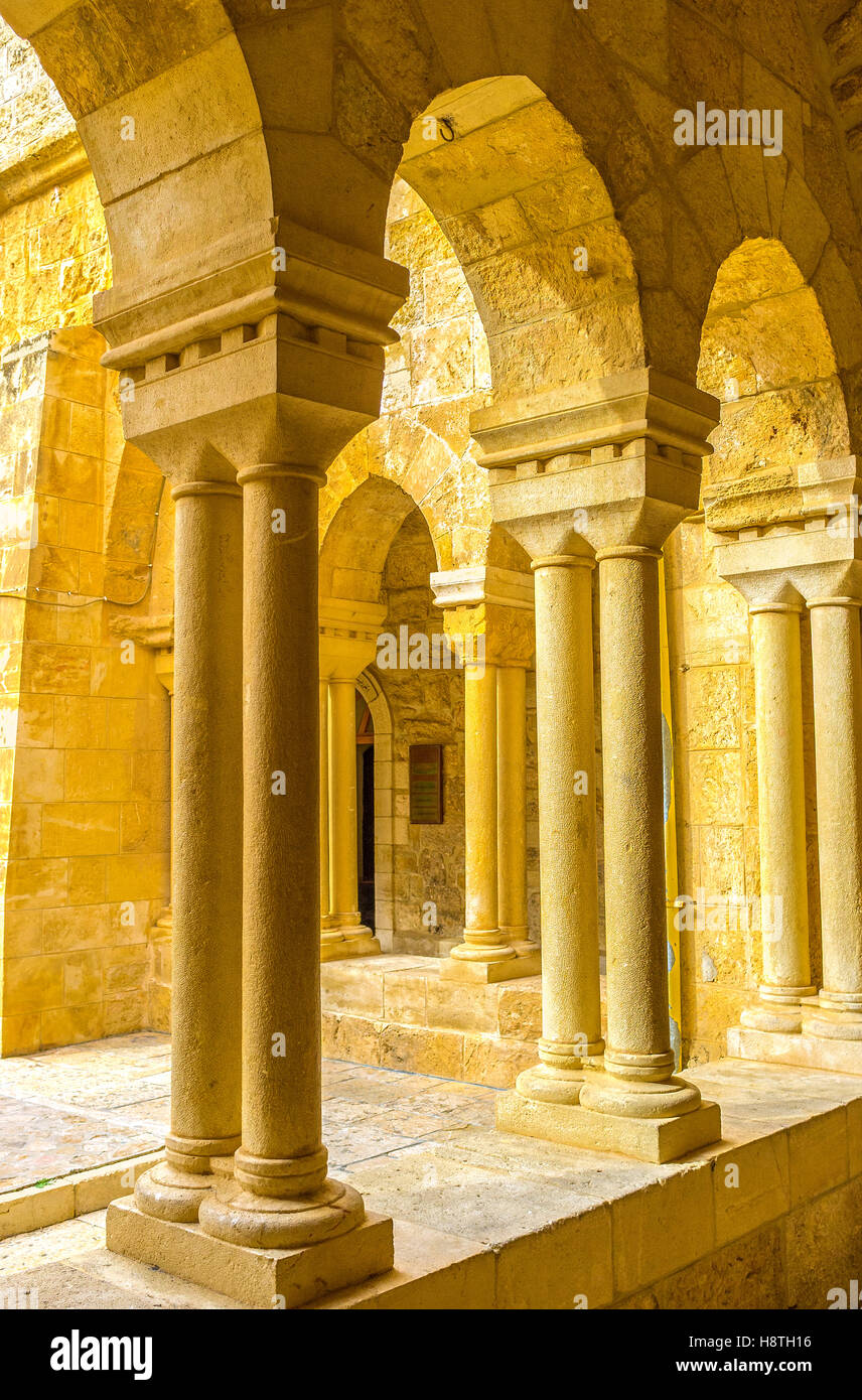 The columns of the covered gallery next to the inner courtyard of the Church of the Nativity Stock Photo