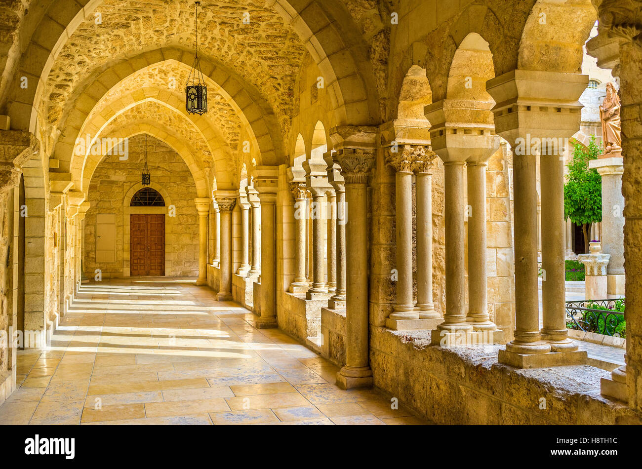 The inner courtyard of the Church of the Nativity is surrounded by beautiful covered terraces with stone columns Stock Photo