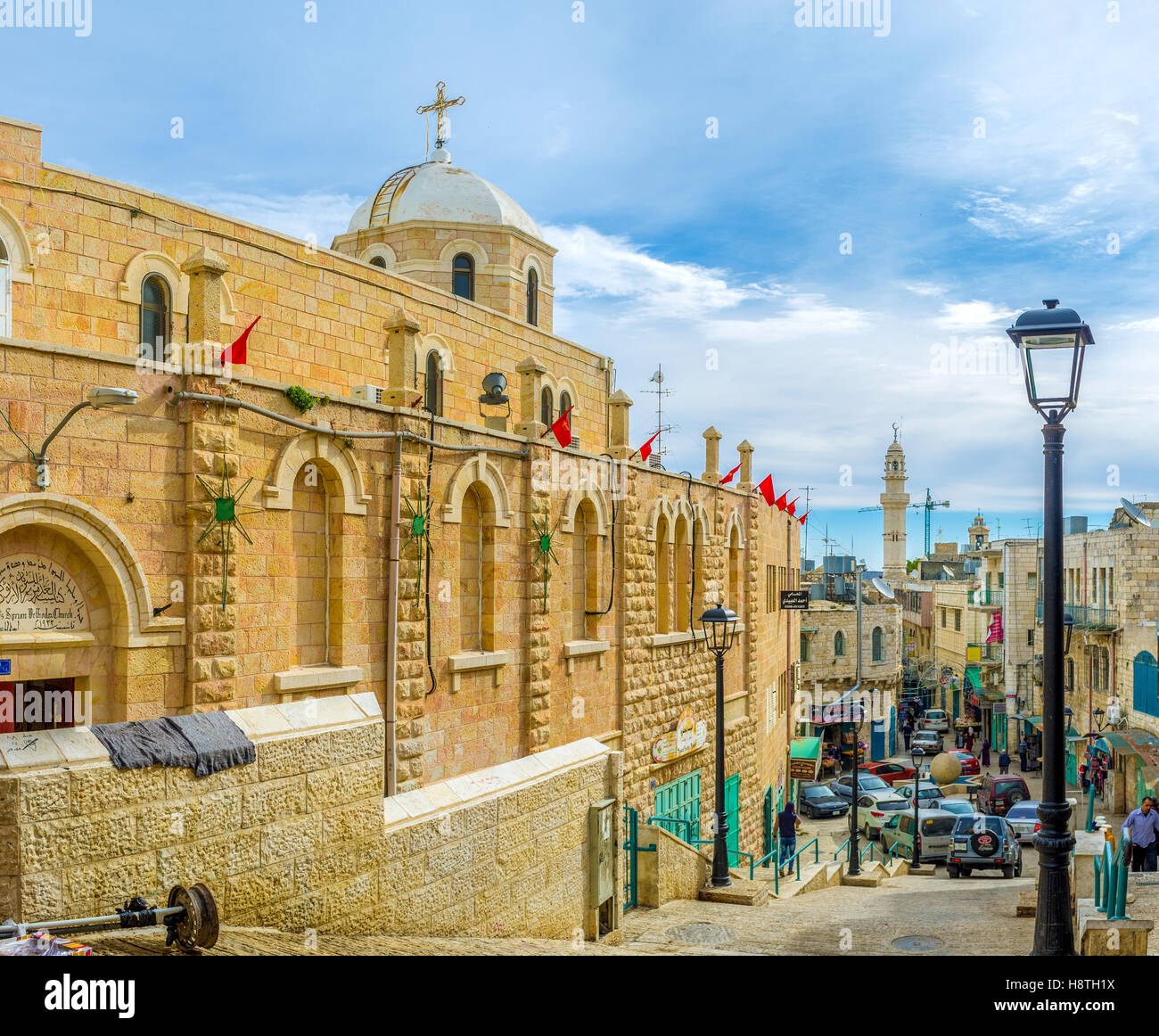 The main street of the pilgrimage city with a lot of religion sites such as St. Mary Syrian Orthodox Church Stock Photo