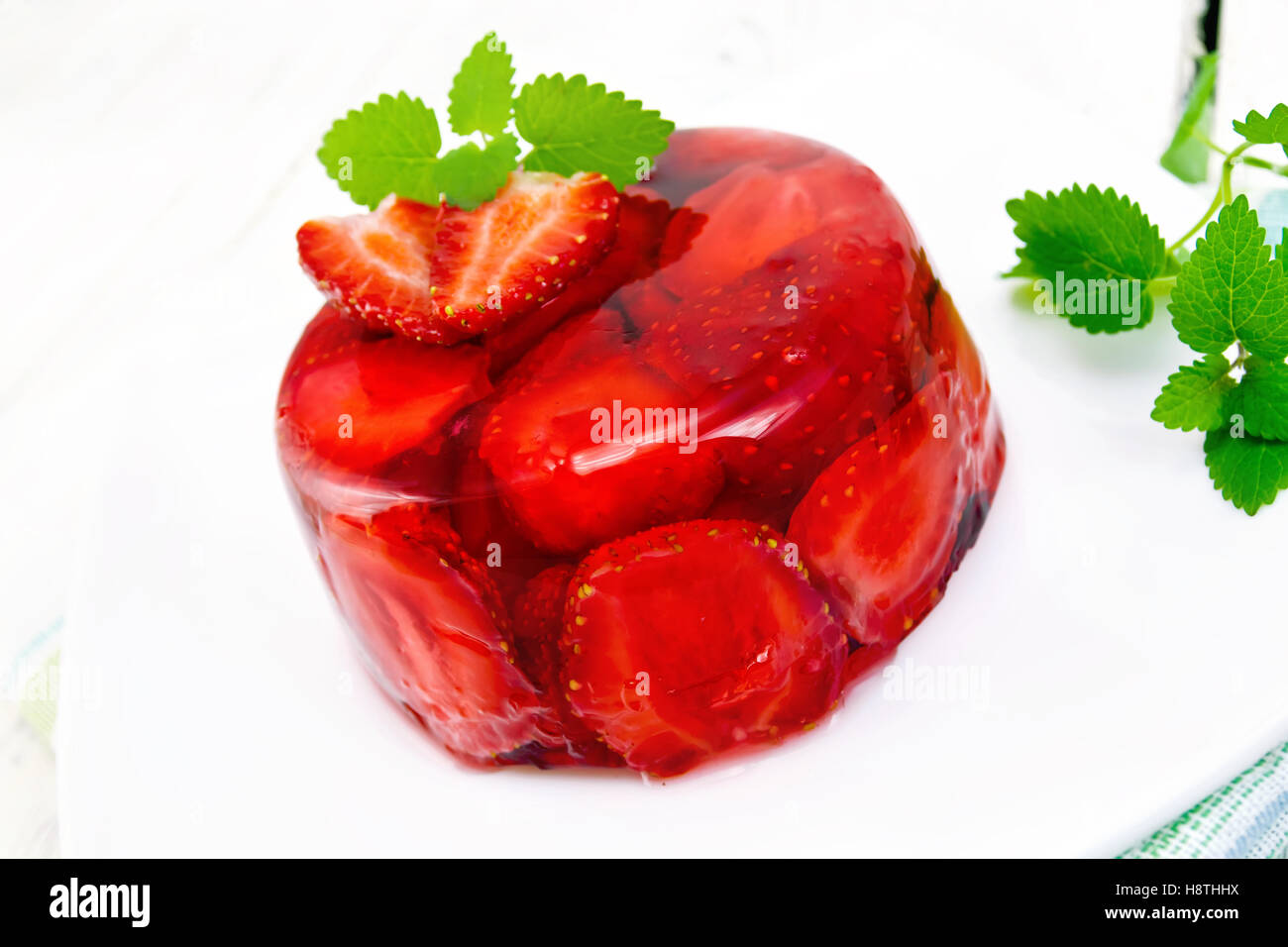 Jelly strawberry with mint on napkin and light board Stock Photo Alamy
