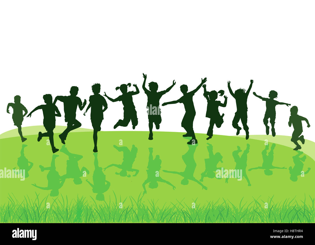 Children jump and frolic in the meadow Stock Photo