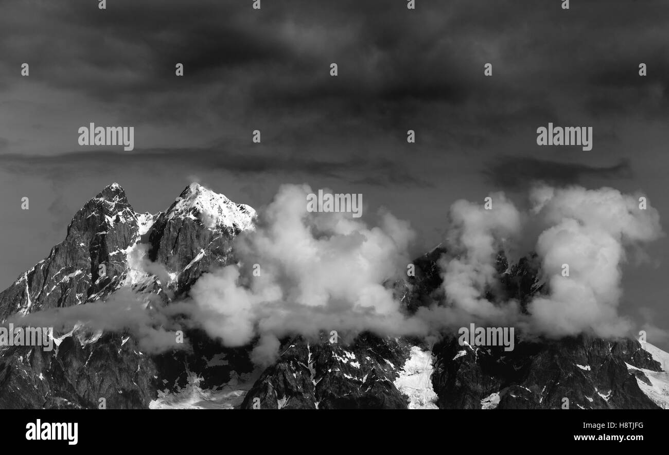 Black and white view on Mt. Ushba in clouds. Caucasus Mountains ...