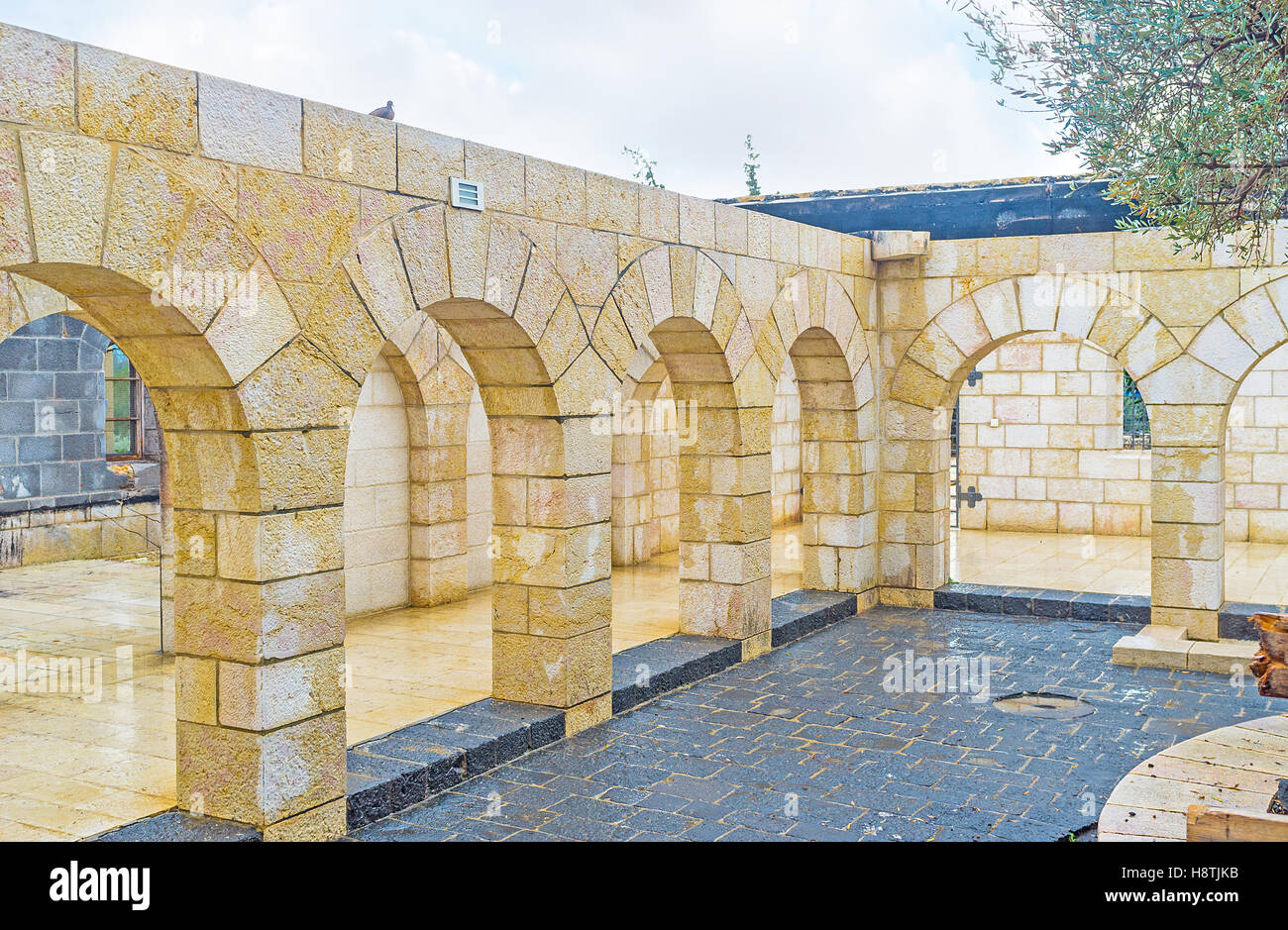 The courtyard of the Multiplication Church with the numerous stone arches Stock Photo